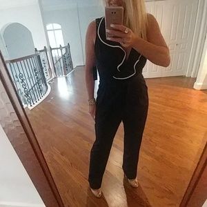 Darling Navy Jumpsuit with White Ruffle Trim!